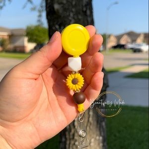 Sunflower badge reel